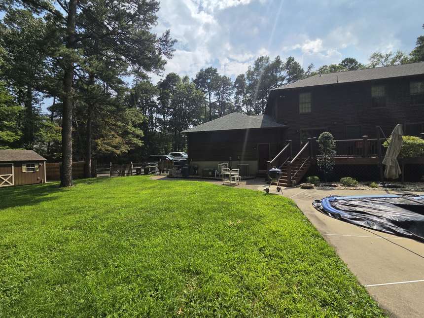 Back yard and shed of an as-is house purchase in Ocean County NJ